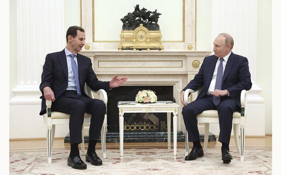 Syrian President Bashar Assad, left, speaks with Russian President Vladimir Putin during their meeting in Moscow, Russia, Wednesday, July 24, 2024. (Valery Sharifulin, Sputnik, Kremlin Pool Photo via AP)