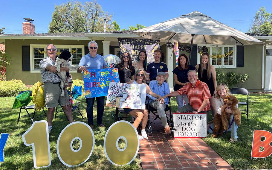 The Moore family gathers for the 100th birthday celebration, which included hundreds of canines for Robert Moore’s petting pleasure.