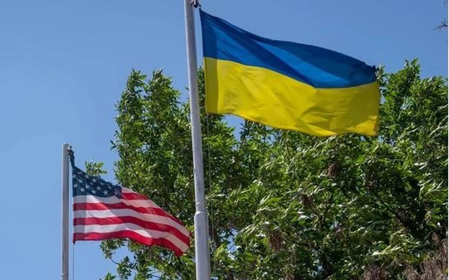 The flag of the United States next to the Ukrainian flag.