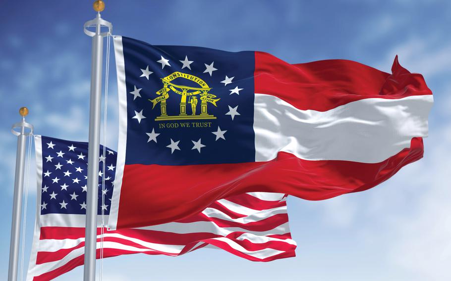 The state flag of Georgia and U.S. flag.