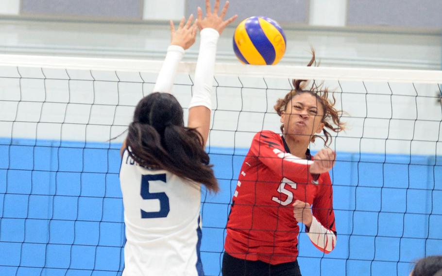 E.J. King and Osan play girls volleyball.