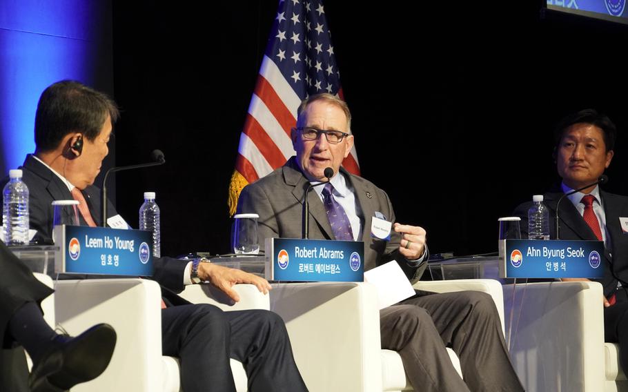 Retired general Robert Abrams speaks on panel alongside retired South Korean generals.