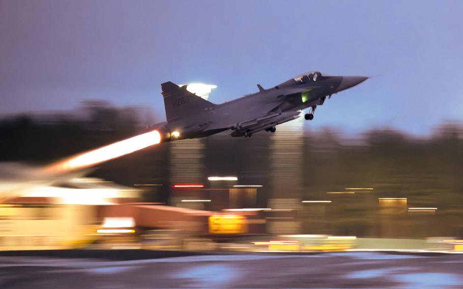 A JAS 39 Gripen C/D takes off during a military exercise at Luleå-Kallax Airport near Luleå, Sweden, on March 4, 2024.