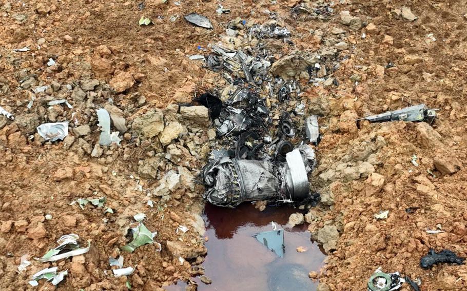 Debris from an F-16C Fighting Falcon that crashed into a farm field near Osan Air base, South Korea, May 6, 2023. 