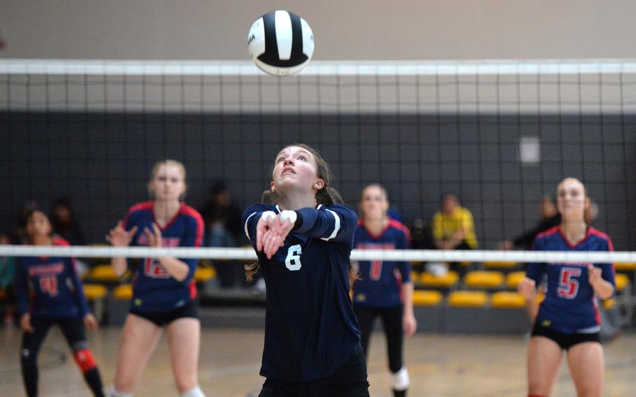 Black Forest Academy’s Emma Gibson gets ready to return the ball as Aviano Saints defenders wait across the net. Aviano beat BFA 25-19, 25-21, 24-26, 25-23 to capture the Division II DODEA-Europe volleyball crown at Ramstein, Germany, Oct. 28, 2023.