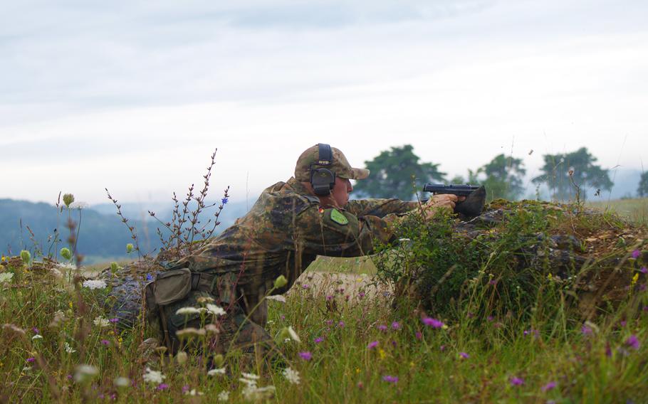 A German sniper fires his pistol at targets during the eighth annual European Best Sniper Team Competition on Aug. 8, 2024, at the Joint Multinational Readiness Center in Hohenfels, Germany.