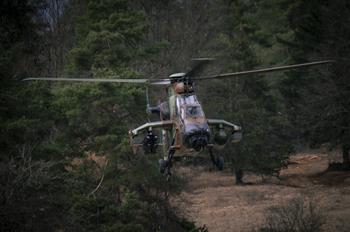 A French attack helicopter takes flight during exercise Allied Spirit.