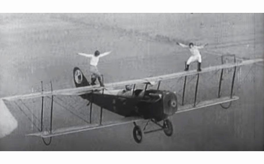 A video screen grab shows two female wing walkers.