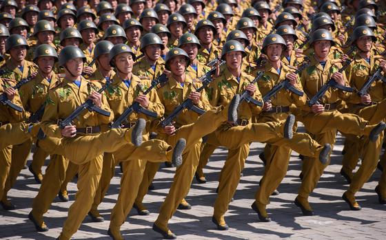 Korean People's Army (KPA) soldiers march during a mass rally on Kim Il Sung square in Pyongyang on Sept. 9, 2018. North Korea held a military parade to mark its 70th birthday, but refrained from showing off the intercontinental ballistic missiles that have seen it hit with multiple international sanctions. (Ed Jones/AFP/Getty Images/TNS)