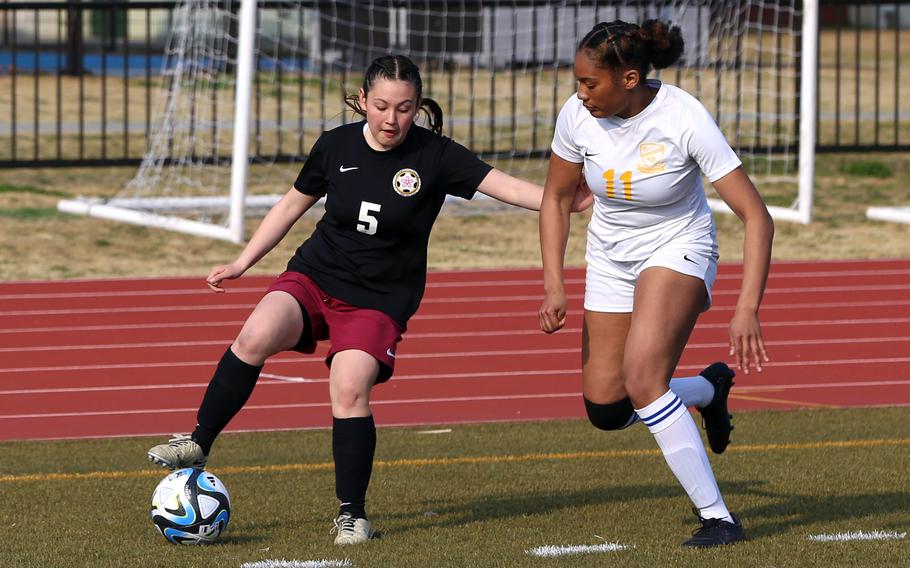 Priscilla Ramirez tries to maneuver with the ball.