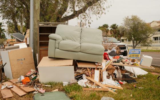 Piles of debris from Hurricane Helene remain uncollected ahead of Hurricane Milton's expected landfall in Treasure Island, Fla., on Oct. 7. MUST CREDIT: Tristan Wheelock/Bloomberg