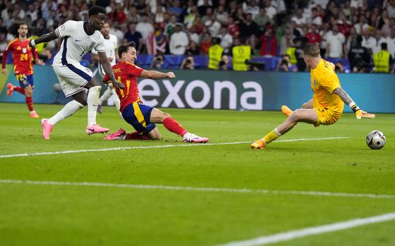 Spain's Mikel Oyarzabal, center, scores his side's second goal during the final match between Spain and England at the Euro 2024 soccer tournament in Berlin, Germany, Sunday, July 14, 2024. (AP Photo/Manu Fernandez)