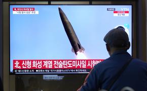 A TV screen shows a file image of North Korea's missile launch during a news program at Seoul Railway Station in Seoul, South Korea, Tuesday, July 2, 2024.