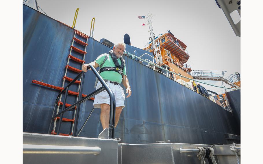 Captain Steve Sottak prepares to disembark from the Abundance/Harvest after guiding the barge from Port Sutton on June 10, 2024, in Tampa, Florida.