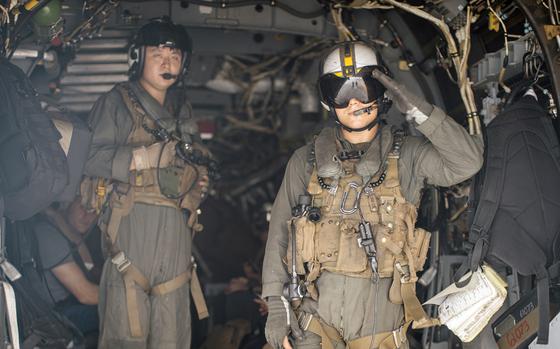 Sgt. Hunter Clark, an MV-22 tiltrotor crew chief for Marine Medium Tiltrotor Squadron 165 (Reinforced), 15th Marine Expeditionary Unit, signals ready for takeoff from the amphibious assault ship USS Boxer for a humanitarian assistance mission while underway in the East China Sea, Oct. 5, 2024. 