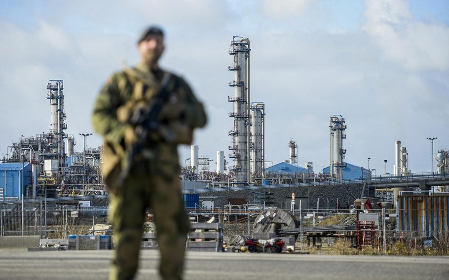 A Norwegian Home Guard soldier stands guard, assisting the police with increased security, at the Karst gas processing plant in the Rogaland county, Norway, on Oct. 3, 2022.  Norway, now the biggest supplier of gas to Europe, beefs up security around its oil installations, following allegations of sabotage on Nord Stream’s Baltic Sea pipelines. 