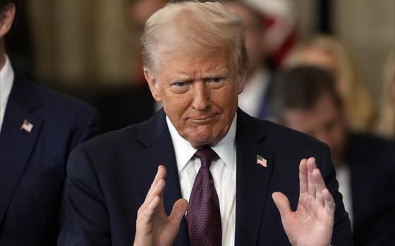 President Donald Trump gestures during the 60th Presidential Inauguration in the Rotunda of the U.S. Capitol in Washington, Monday, Jan. 20, 2025. (AP Photo/Julia Demaree Nikhinson, Pool)