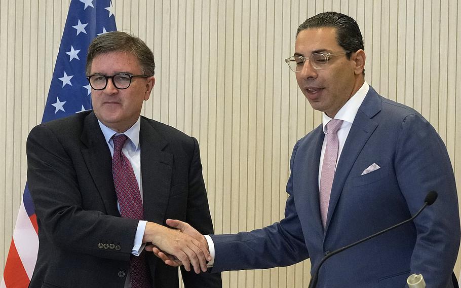 Assistant Secretary of State for European and Eurasian Affairs James O’Brien, left, and Cyprus’ foreign minister Constantinos Kompos shake hands in Nicosia, Cyprus, Oct. 23, 2024.