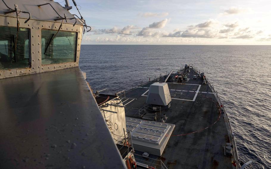 The USS Preble sails on the South China Sea with clouds in the distance.