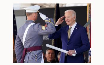U.S. President Joe Biden presents a diploma to a graduate cadet during the United States Military Academy commencement in West Point, N.Y., May 25, 2024. 