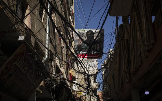 A poster showing Abu Obaida, the spokesman for Hamas's military wing, on the streets of Burj Barajneh, a Palestinian refugee camp in Beirut. MUST CREDIT: Diego Ibarra Sanchez for The Washington Post