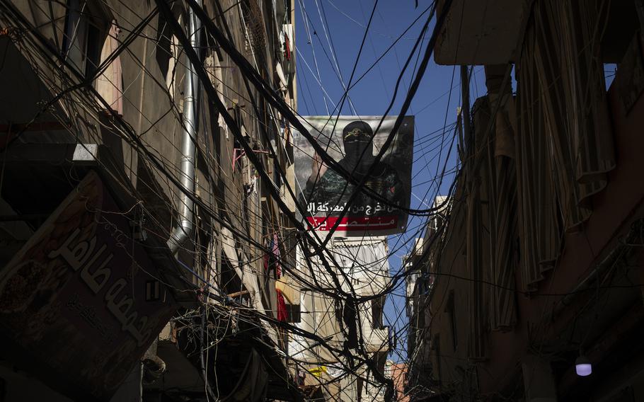 A poster showing Abu Obaida, the spokesman for Hamas’s military wing, on the streets of Burj Barajneh, a Palestinian refugee camp in Beirut. 