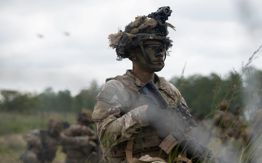 A soldier with the 101st Airborne Division stands guard during an air assault demonstration in Carentan, France, on June 2, 2024, as part of D-Day commemoration events in Normandy.