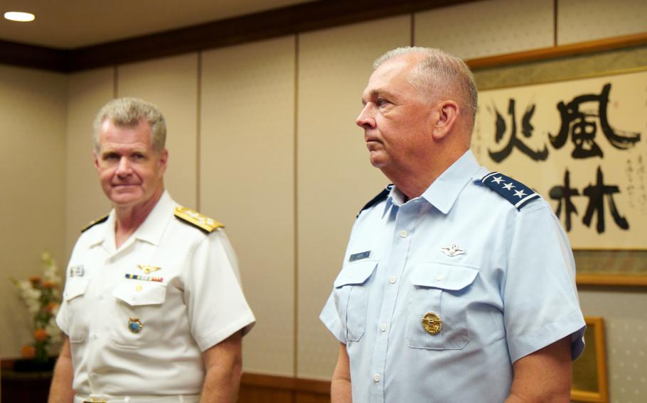 The head of U.S. Indo-Pacific Command, Adm. Samuel Paparo, left, and the commander of U.S. Forces Japan, Air Force Lt. Gen. Ricky Rupp, attend a trilateral meeting at Camp Ichigaya, Tokyo, Thursday, July 18, 2024. 