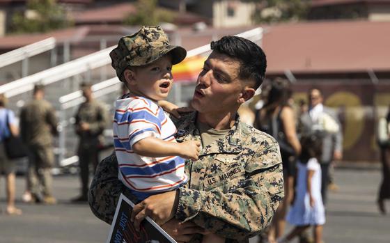 U.S. Marine Corps Capt. Ruben Pickering, a forward air controller with Charlie Company, Battalion Landing Team 1/5, 15th Marine Expeditionary Unit, and a native of Costa Rica, is welcomed by his son after returning from a routine deployment at Marine Corps Base Camp Pendleton, California, Aug. 10, 2024. Elements of the 15th Marine Expeditionary Unit, embarked aboard amphibious transport dock USS Somerset (LPD 25), returned to Marine Corps Base Camp Pendleton after a seven-month deployment to the Indo-Pacific region in support of regional stability and a free and open Indo-Pacific. (U.S. Marine Corps photo by Sgt. Bryant Rodriguez)