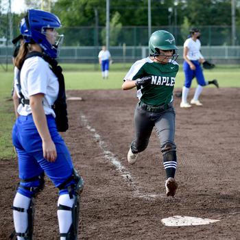 Naples’ Rose Morales steps on home plate during the Division II/III DODEA European softball championship game against Rota on May 24, 2024, at Kaiserslautern High School in Kaiserslautern, Germany.