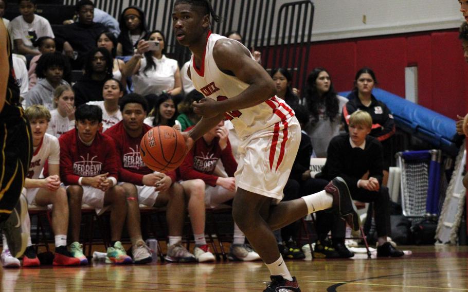 Nicholas Whyte dribbles up the court.