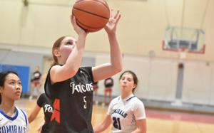 American Overseas School of Rome's Gloria Olivieri puts up a shot in a victory over Rota earlier this month. The Falcons are hosting Bahrain and Aviano this weekend in an Play4Kay event that serves as a fundraiser and awareness campaign about cancer.

Kent Harris/Stars and Stripes