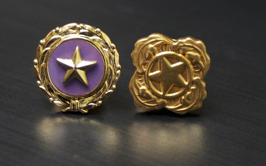 The Gold Star lapel button. 