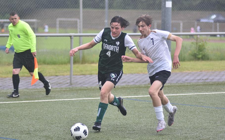 AFNORTH's Gabriel Hatfield, left, and Alconbury's Anthony Sheehan battle each other and the rain Tuesday, May 21, 2024, at the DODEA European Division III boys soccer championships at Landstuhl, Germany.