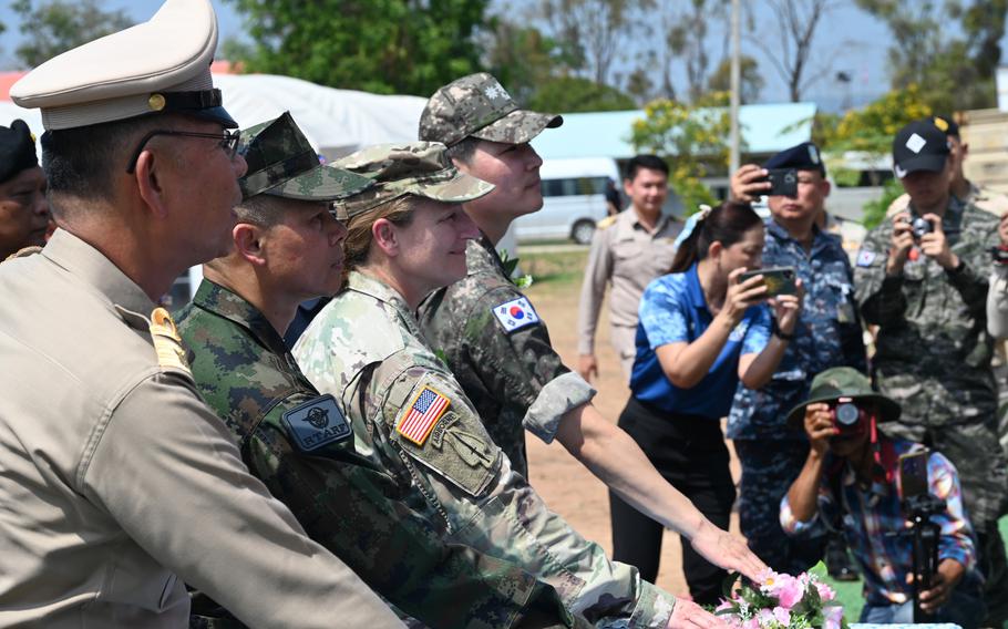 Representatives from the Thai government, Thai military, U.S. Army and Korean navy participate in a ceremony.