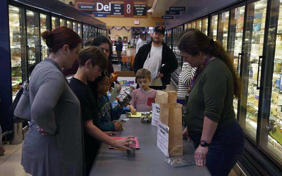 Students from John O. Arnn Elementary School comparison shopped, weighed and measured produce and calculated price per unit of everything from coffee to canned goods, Oct. 10, 2024, during Math Knight in the commissary at Sagamihara Family Housing Area near Camp Zama, Japan.