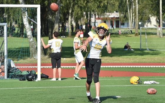 SHAPE quarterback Keller Schutt throws a pass during an Aug. 27, 2024, football practice in Mons, Belgium. Schutt is one of the few returners for the Spartans heading into the season.