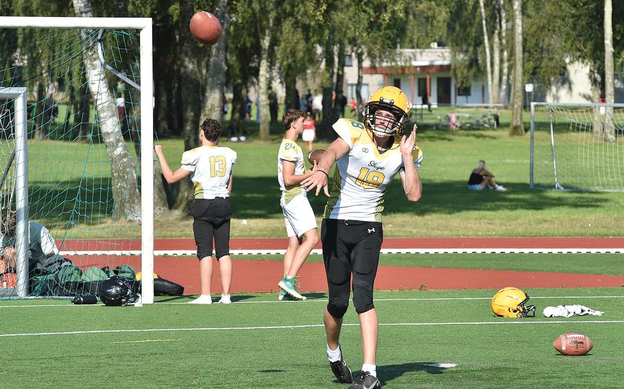 SHAPE quarterback Keller Schutt throws a pass during an Aug. 27, 2024, football practice in Mons, Belgium. Schutt is one of the few returners for the Spartans heading into the season.