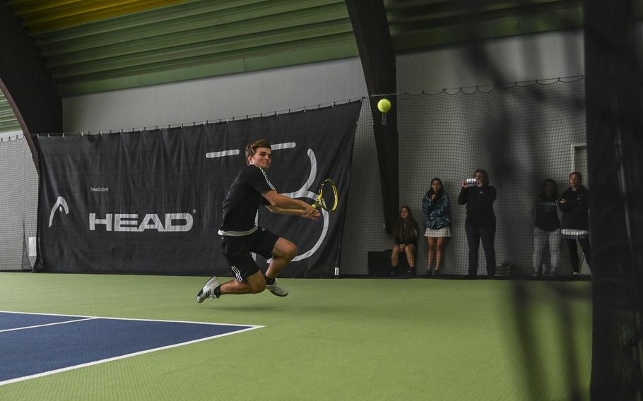 Stuttgart's Zachary Call leaps to intercept the ball during a doubles match against Naples' Kai Barania and Tavi Shah with his partner Hunter Leslie-Persons at the DODEA European tennis championships at T2 Sports Health Club in Wiesbaden, Germany, on Oct. 21, 2023.