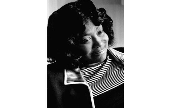 Gospel singer Mahalia Jackson talks to a reporter at her Tokyo hotel. 