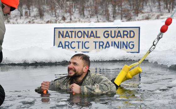 Staff Sgt. Duane Southworth, a Security Forces specialist assigned to the 148th Security Forces Squadron, 148th Fighter Wing, Minnesota Air National Guard, participated in a cold-water immersion as part of the Air National Guard's cold weather operations course at Camp Ripley Training Center, Minn., Feb. 7, 2025.  Students participated in a six-day, five-night Field Training Exercise where they traveled on foot in subzero temperatures, using land navigational skills, to build camps featuring either a 10-man Arctic tent or thermal shelters made from materials found in nature. Students were comprised of mostly Security Forces specialists, but also included a Maintenance Group Commander, Physician Assistant, Cyber Communications Specialist, and a Public Affairs Specialist. The course taught service members to conduct mission-essential tasking in extreme cold environments.  (U.S. Air National Guard photo by Audra Flanagan)