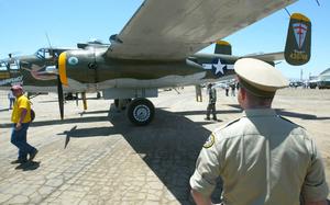 A man in uniform looking at an aircraft