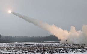 A High Mobility Artillery Rocket System belonging to the U.S. Army-led Task Force Voit is enveloped in smoke after launching a test rocket near Tapa, Estonia, on Jan. 27, 2025.