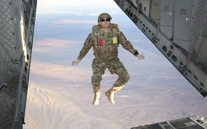 A military free fall instructor from the U.S. Army John F. Kennedy Special Warfare Center and School jumps from an aircraft onto Phillips Drop Zone at Yuma Proving Ground, Arizona December 4, 2019. The instructors trained students in basic free fall techniques jumping from altitudes of 9,500 to 25,000 feet with and without weapons, combat equipment, night vision goggles and supplemental oxygen in day and night conditions. (U.S. Army photo by K. Kassens)