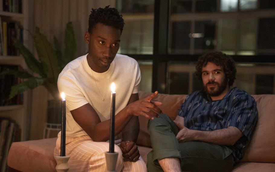 This image released by Universal Pictures shows Nathan Stewart-Jarrett and Kyle Kaminsky in a scene from "Candyman," directed by Nia DaCosta.