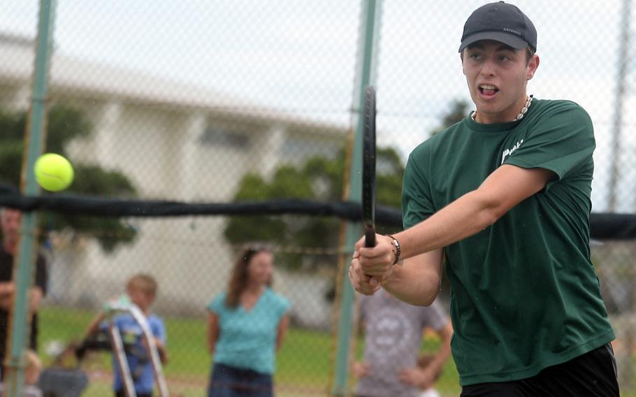 Kubasaki's Jacy Fisk hits a backhand during Tuesday's Okinawa tennis singles matches. Fisk lost to Kadena's Micah Berry 6-2.