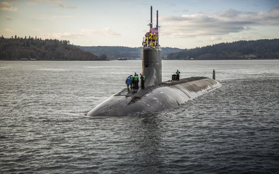 In this Dec. 15, 2016, photo, provided by the U.S. Navy, the Seawolf-class fast-attack submarine USS Connecticut departs Puget Sound Naval Shipyard for sea trials following a maintenance availability. The Navy said the nuclear-powered submarine was conducting routine operations Oct. 2, 2021, when it struck an uncharted undersea mountain in the South China Sea.