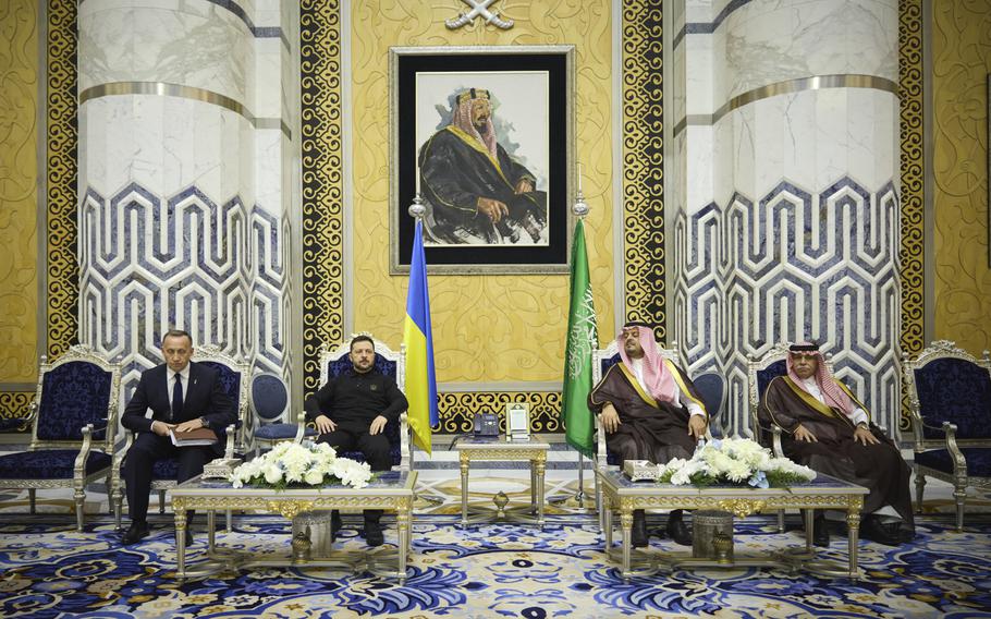 Ukrainian President Volodymyr Zelenskyy, center left, meets with Prince Saud bin Mishaal, deputy governor of Saudi Arabia’s Mecca region, center right, and Saudi Commerce Minister Majid bin Abdullah al-Qasabi 