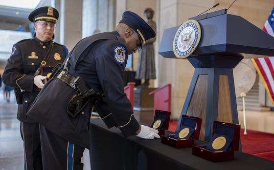 U.S. Capitol Police honor guards place Congressional Gold Medals to be presented at a ceremony to honor the Black women mathematicians of NASA who contributed to the space race and who were the subject of the movie "Hidden Figures," at the Capitol in Washington, Wednesday, Sept. 18, 2024. (AP Photo/J. Scott Applewhite)