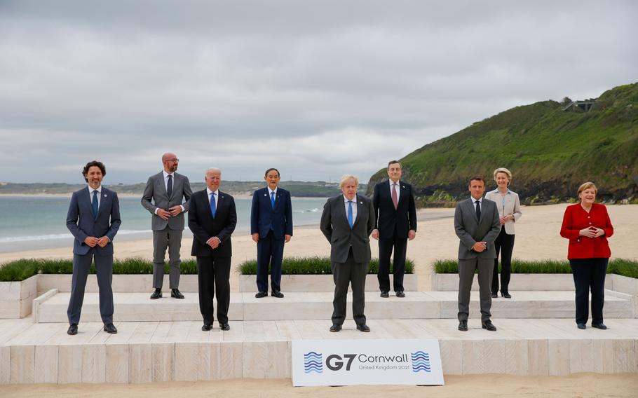 Trudeau, Michel, Biden, then-Japanese Prime Minister Yoshihide Suga, Johnson, Draghi, Macron, von der Leyen and then-Germany Chancellor Angela Merkel at the family photo for the G-7 summit in the UK in June 2021. 